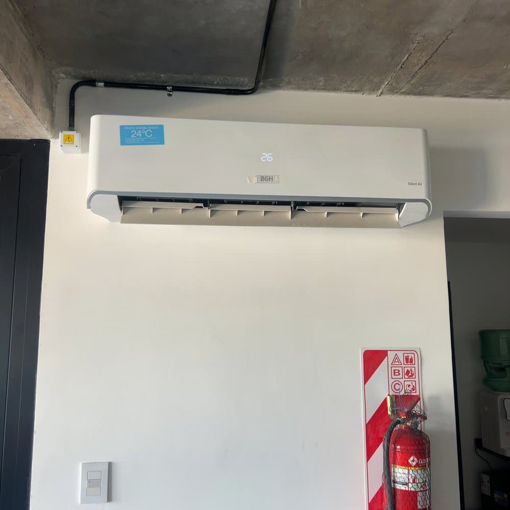Air conditioner on a clean white wall, photographed through a Rial capture link